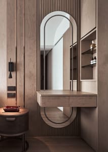 Modern minimalist dressing table with wood finish, featuring an oval mirror and a floating desk designed to enhance functiona