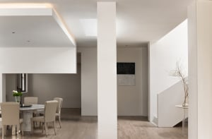 Modern minimalist residential interior with neutral color palette and clean lines.