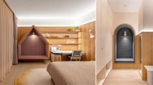 A modern bedroom featuring wood-paneled walls, a built-in shelving unit with a desk and chair, and a cozy alcove seating area