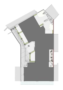 A detailed architectural plan showing a modern building with concrete and tiled flooring.