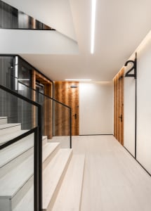 Modern residential interior with metal-clad wall and white marble floor