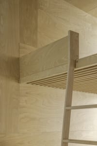 A modern architecture interior with a wall made of wood panels