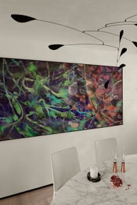 A vibrant abstract painting adorned the wall of a modern interior design space.