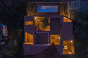 Aerial view of a modern residential architecture featuring a pool, tree, and open spaces with ceramic tile flooring and stair