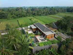 Aerial view of a modern residential architecture featuring mixed materials
