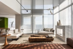 Contemporary living room featuring marble and metal elements