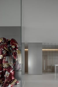 A minimalist interior with a metallic Hulkbuster sculpture.
