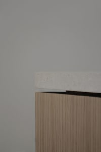 A minimalist interior design with wooden elements.