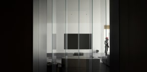 Modern minimalist living room with large glass walls and a sleek, contemporary sofa.