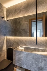 Modern minimalist bathroom interior with marble and concrete accents