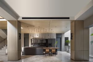 An image of a modern residential kitchen featuring black metallic materials.