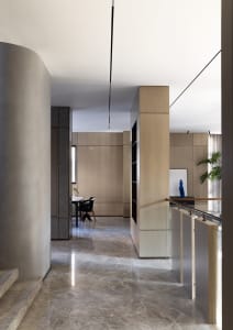 Modern residential interior with marble furniture and mixed materials, featuring clean lines and contemporary design elements