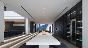 A sleek, modern dining room with minimalist design, concrete floors, glass walls, and black accent walls.