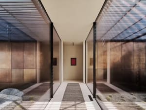 A modern interior space with sleek metallic walls, a long corridor, and a minimalist design.