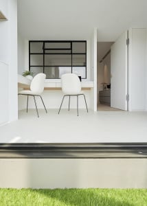 A minimalist home office featuring a sleek, white minimalist desk and chairs with black frames, set against a white backgroun