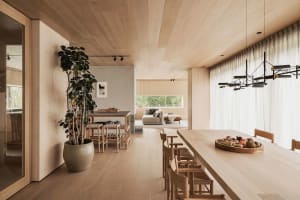Modern residential interior design with wood materials and a minimalistic approach.