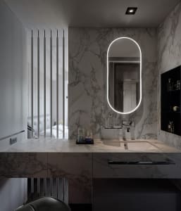 Modern bathroom featuring geometric design, geometric marble tiles, and geometric marble basin.