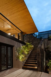 A modern entrance featuring stone and wooden elements.