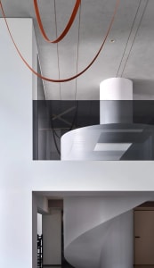 Interior space with modern architectural elements like glass, concrete, and steel.
