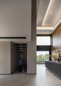 A modern residential space featuring a concrete floor and minimalist design.
