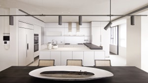A modern, minimalist kitchen with white cabinets and a sleek, white countertop.