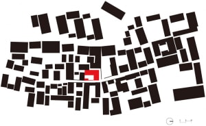 A black and white map of an urban area with a red square marking a specific location.