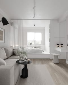 Modern minimalist bedroom with white furniture, wood flooring, and a window with sheer curtains.
