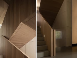 Staircase with wooden walls and steps in a minimalist interior design.