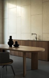 A modern kitchen featuring wooden furniture with a sleek, minimalist design.