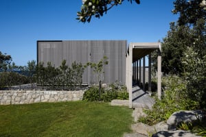 A modern residential architecture featuring a wooden exterior.