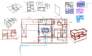 A hand-drawn architectural sketch featuring colorful paper with various room designs.