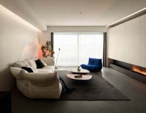 Modern living room with minimalist furniture and concrete elements