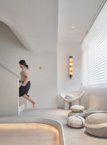 Modern minimalist interior design featuring concrete and glass elements.