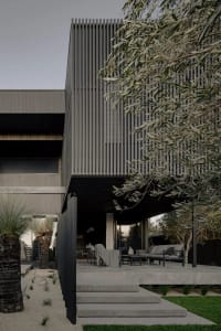 Modern metal-clad residential home exterior with a sleek, minimalist design.