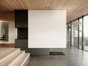 Modern minimalist living room with concrete and wood materials