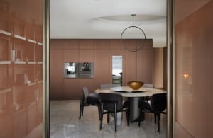 A modern dining room featuring metallic furniture and fixtures.