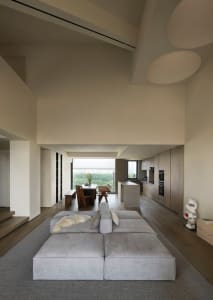 A modern living room featuring neutral-toned furniture and decor.