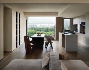 Modern, contemporary living room with concrete furniture, featuring minimalist design elements and a sleek, urban aesthetic.