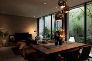Modern living space with concrete, glass, and wood elements