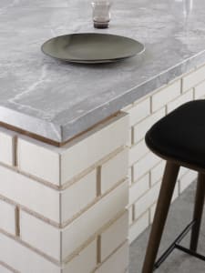A sleek, modern kitchen counter featuring a marble surface.