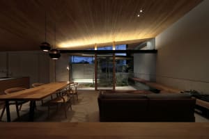 A modern living room with wooden furniture and a minimalist design.
