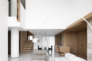 Modern interior design featuring wooden and marble elements.
