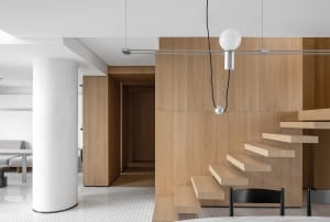 A modern minimalist interior design with wooden elements and a minimalist aesthetic.