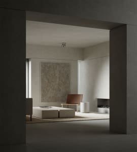 Modern minimalist living room featuring minimalist furniture and concrete surfaces