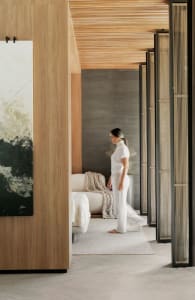 A minimalist interior design featuring wood and glass materials