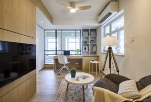 Modern living room featuring wooden furniture and a round coffee table.