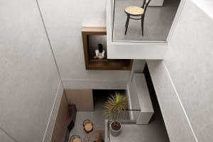 A modern interior design space featuring marble surfaces and concrete accents.