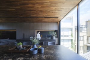 Modern residential kitchen featuring a marble countertop and minimalist design.