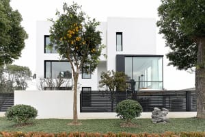 A modern building with large glass windows and white walls.