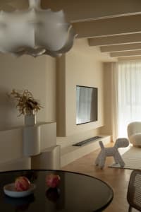 A minimalist living room with modern materials and a sleek, contemporary design.